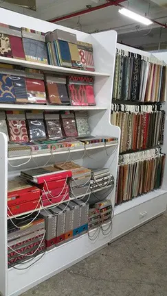 Shelves of interior-design swatch books
