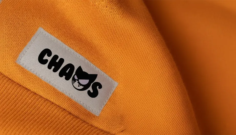 CHAOS woven label on an orange garment