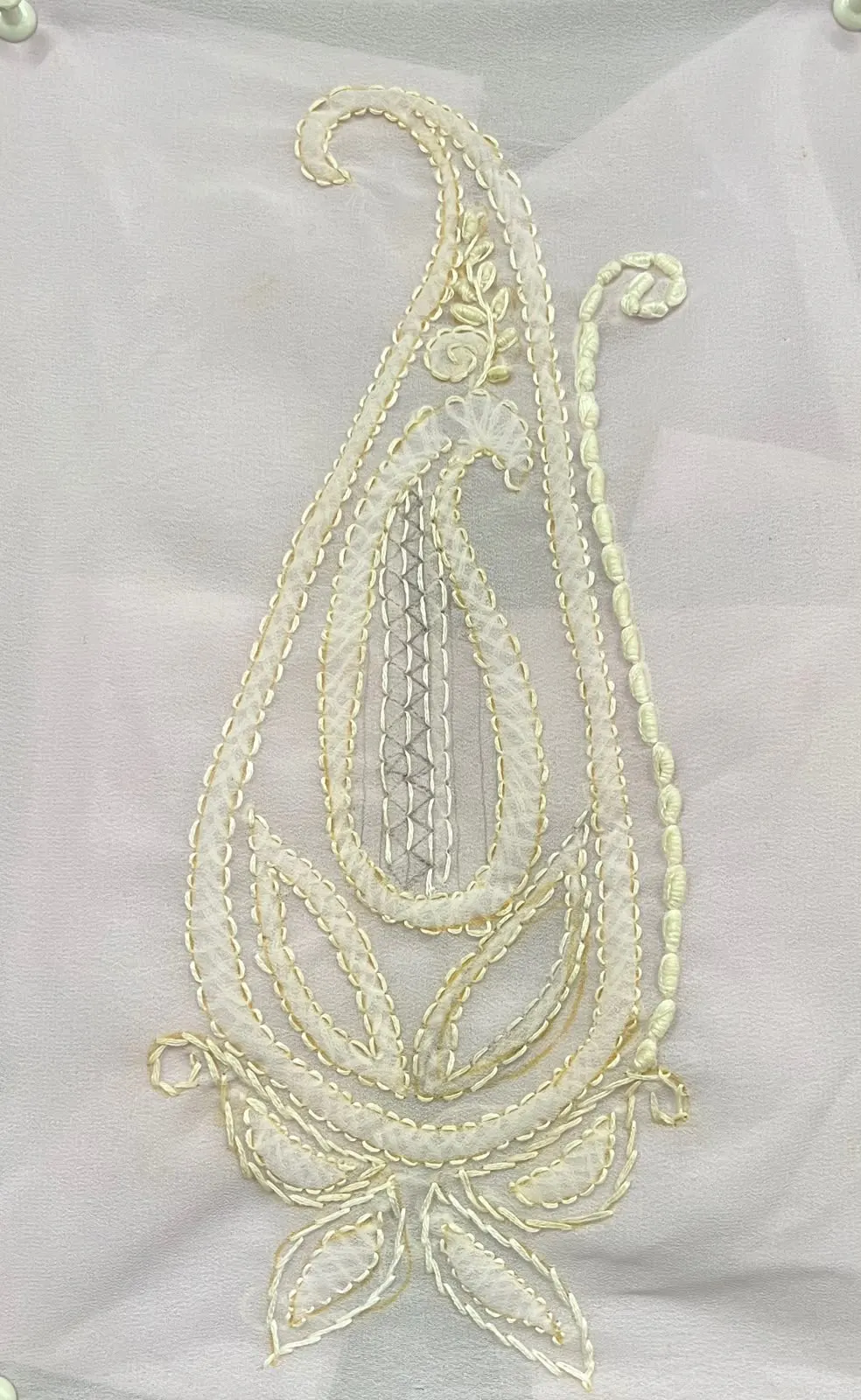 Chikankari embroidery: a white paisley on sheer fabric