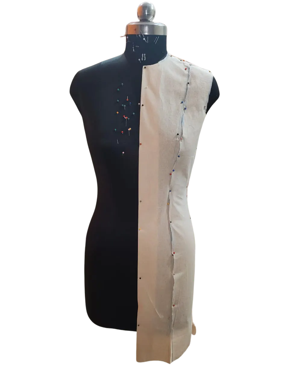 Base garment toile pinned on the dress form