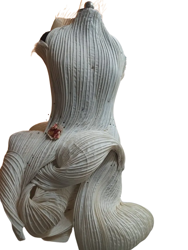 The dress mid-construction with an embroidered embellishment pinned in place
