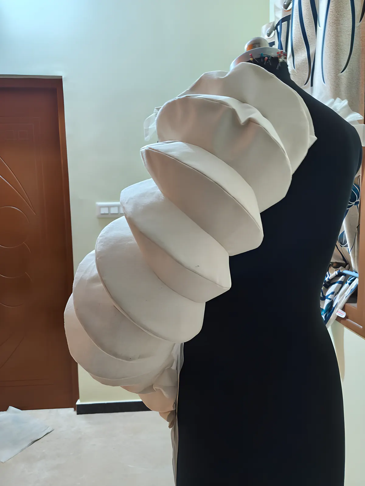 Erosion: layered panel sleeve on the dress form