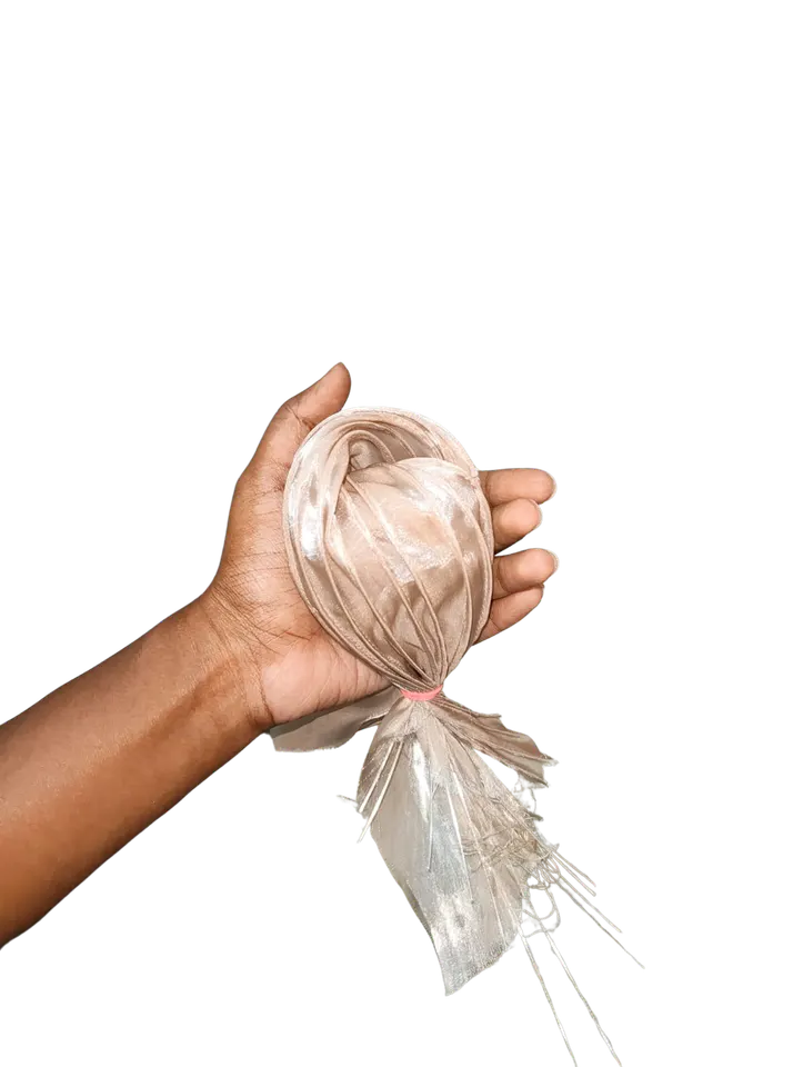 A hand holding a fabric shell form