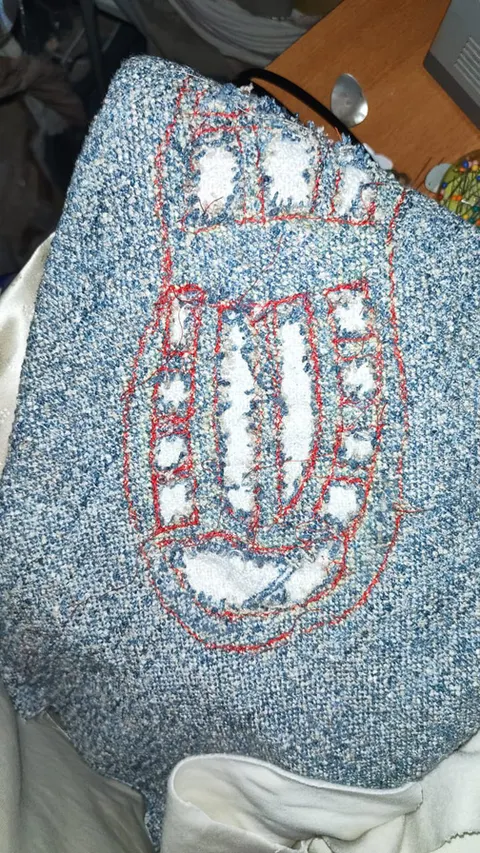 Slashed layer sample with red stitching